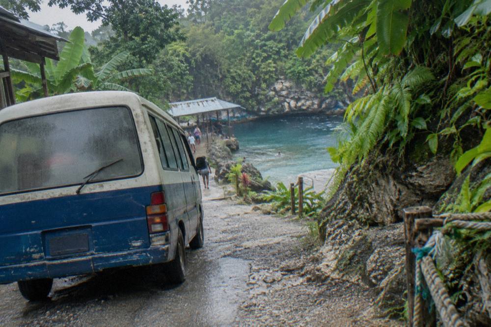 Coastal road winding along the green hills of Jamaica's north coast