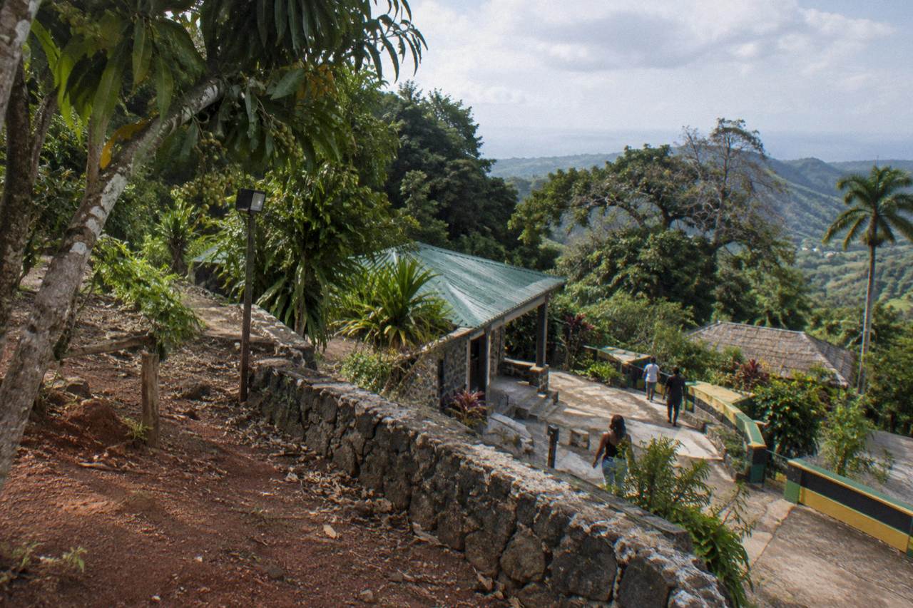 Mountain road winding through green hills above the north coast of Jamaica