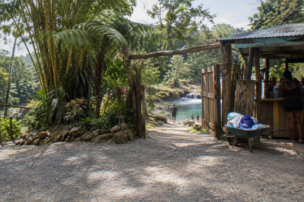 Wooden sign and entry gate at the Island Gully Falls attraction